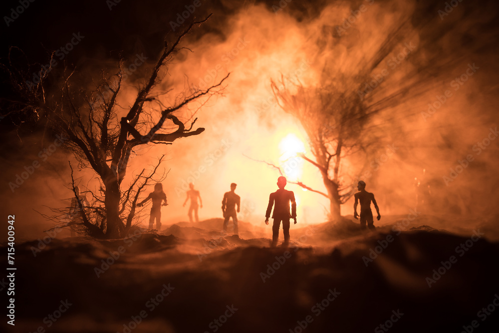 Silhouette of person standing in the dark forest with light. Horror halloween concept. Silhouette of person standing in the dark forest with light. Horror halloween concept.