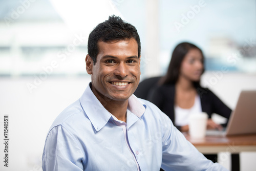 Indian Business man standing in an office