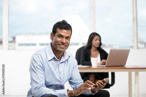 Indian business man using a smartphone