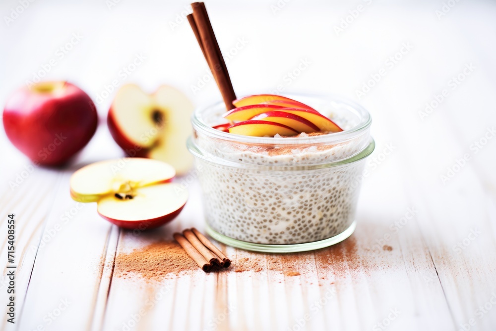chia pudding with a cinnamon stick and apple slices chia pudding with a cinnamon stick and apple slices