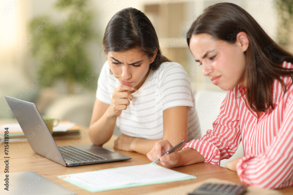 Suspicious tele workers checking contract at home