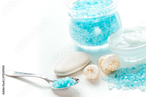 blue sea salt and body cream on white desk background