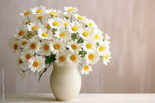 Wallpaper Mural  a white vase filled with lots of white and yellow daisies on top of a white table next to a wall. Torontodigital.ca