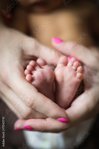 newborn baby feet in mom's hands © Ирина Попова