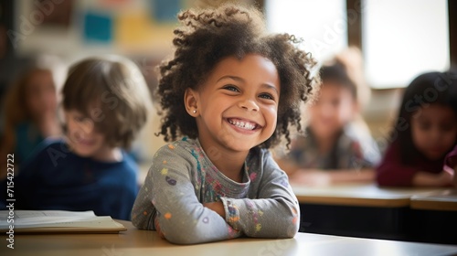 Joyful young girl in classroom, laughing with classmates.