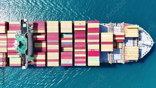 Aerial view of Cargo Container Ship at sunrise. container ship running out of cargo shipyard sea port. export shipping industry freight and transportation logistics concept. commercial shipping by sea photo