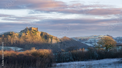 Carreg Cennan Castle, near Llandeilo, south Wales on a frosty winter's morning.  The castle is located on a hilltop, overlooking the rural landscape photo