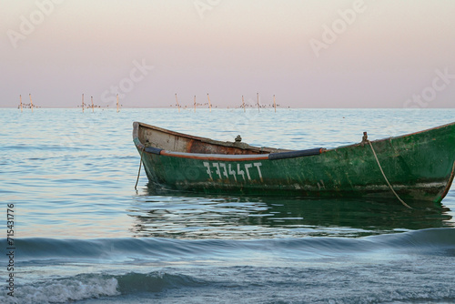 Fototapeta Naklejka Na Ścianę i Meble -  Solitude afloat: boat whispers tranquility.