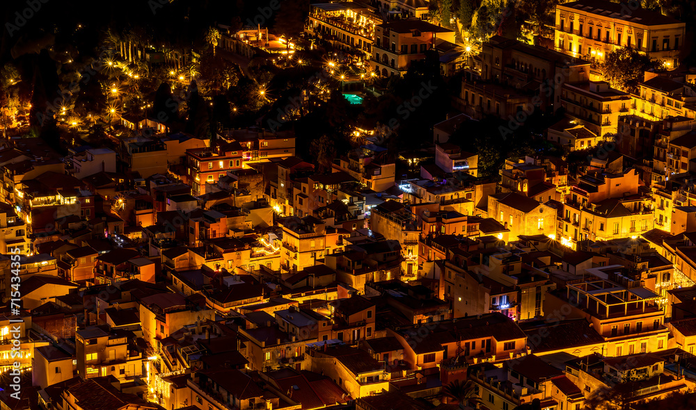 Fototapeta premium Beautiful view of night town of Italy with colorful golden lights, night landscape on city of Europe