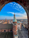 Cremona panorama of the cathedral bell tower from the Torrazzo tower at sunset