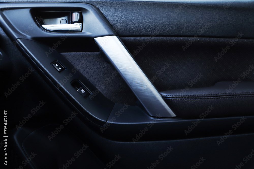 black interior of a modern car. Dashboard. Luxury leather steering wheel. Auto controls. Car doors inside. Car chairs and seats. Car sofa. Back and front row. Interior and door trim. High quality black interior of a modern car. Dashboard. Luxury leather steering wheel. Auto controls. Car doors inside. Car chairs and seats. Car sofa. Back and front row. Interior and door trim. High quality