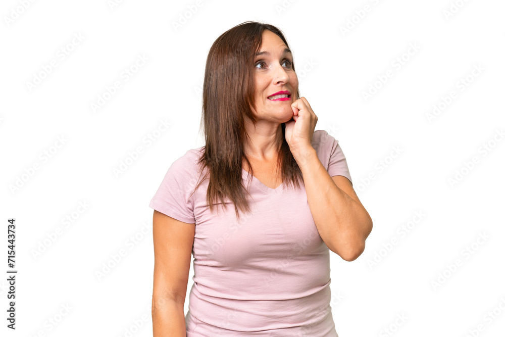 Middle-aged caucasian woman over isolated background is a little bit nervous Middle-aged caucasian woman over isolated background is a little bit nervous