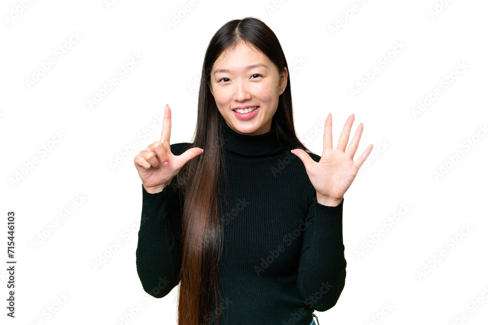 Young Asian woman over isolated chroma key background counting seven with fingers Young Asian woman over isolated chroma key background counting seven with fingers