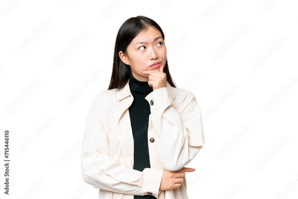 Young Asian woman over isolated chroma key background having doubts and with confuse face expression Young Asian woman over isolated chroma key background having doubts and with confuse face expression
