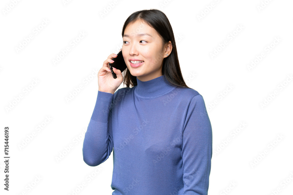 Young Asian woman over isolated chroma key background keeping a conversation with the mobile phone with someone Young Asian woman over isolated chroma key background keeping a conversation with the mobile phone with someone