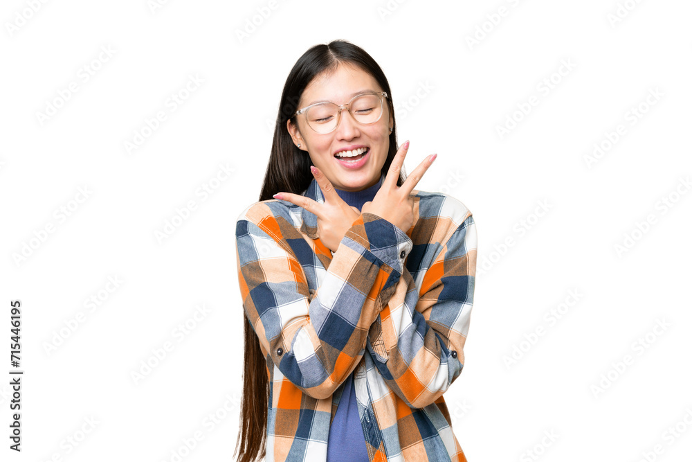 Young Asian woman over isolated chroma key background smiling and showing victory sign Young Asian woman over isolated chroma key background smiling and showing victory sign