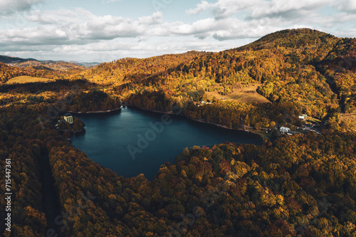 Top view of lake in the middle of autumn forest in Slovakia. Europe traveling concept.