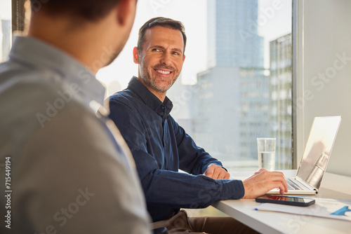 Financial advisor having meeting with customer in office photo