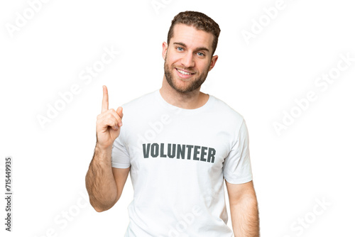 Young volunteer man over isolated chroma key background showing and lifting a finger in sign of the best © luismolinero