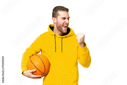 Young handsome blonde man over isolated chroma key background playing basketball