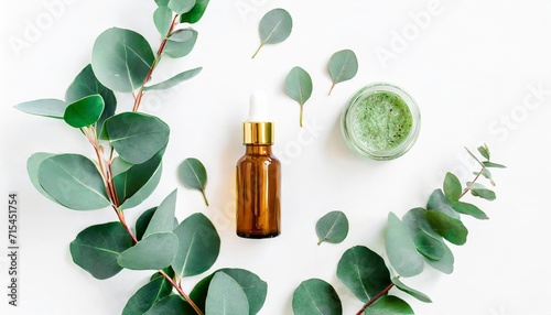 eucalyptus essential oil eucalyptus leaves on white background natural organic cosmetics products medicinal plant natural serums flat lay top view photo