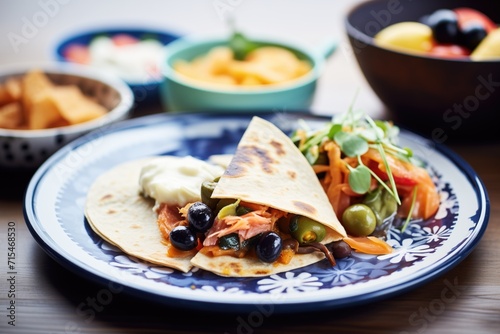 nacho-style quesadilla with cheese and olives
