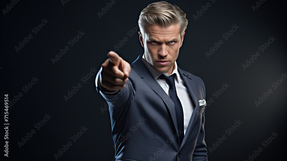 Professional Businessman in a Suit Pointing Finger Against a Grey Background