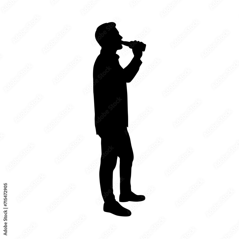 Drunk man in holding bottle and drinking beer while standing isolated