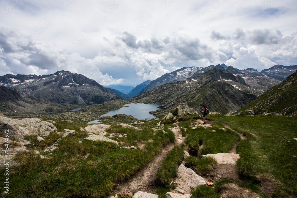 Young hiker girl summit to Montardo Peak in AIguestortes and Sant Maurici National Park, Spain Young hiker girl summit to Montardo Peak in AIguestortes and Sant Maurici National Park, Spain