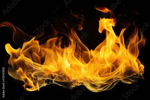 Tongues of yellow fire on clear black background, yellow flames and sparks background design