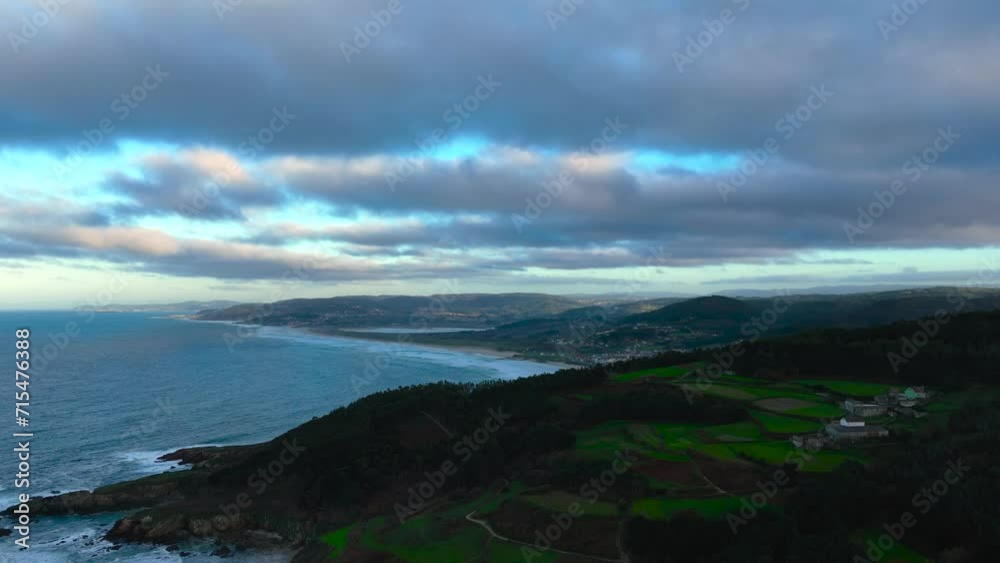 Cloudy Sunset Over Torradas Beach In Coastal Village Of Malpica de Bergantinos In A Coruna, Spain. aerial hyperlapse Cloudy Sunset Over Torradas Beach In Coastal Village Of Malpica de Bergantinos In A Coruna, Spain. aerial hyperlapse