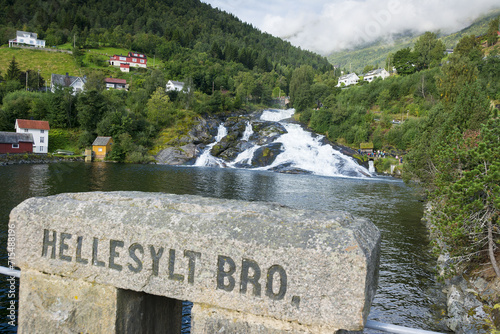 Hellesyllt bride stone sign with the famous waterfall in the background.
