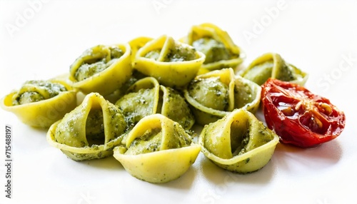 tortellini pasta with pesto and sun dried tomatoes isolated on a white background top and side view italian food bundle photo
