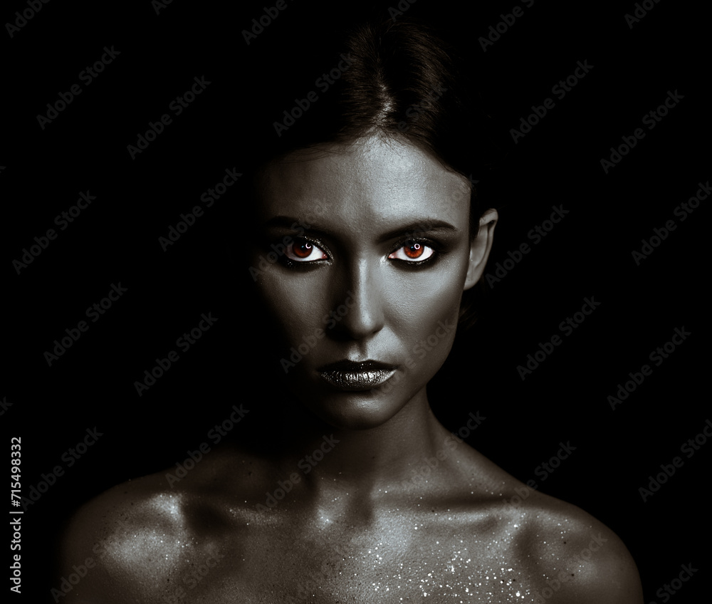 Portrait of a young woman model with black make-up. Portrait of a young woman model with black make-up.