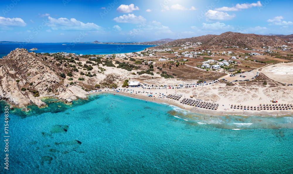 Fototapeta premium Panoramic aerial view of the Mikri Vigla beach with turquoise sea at Naxos island, Cyclades, Greece