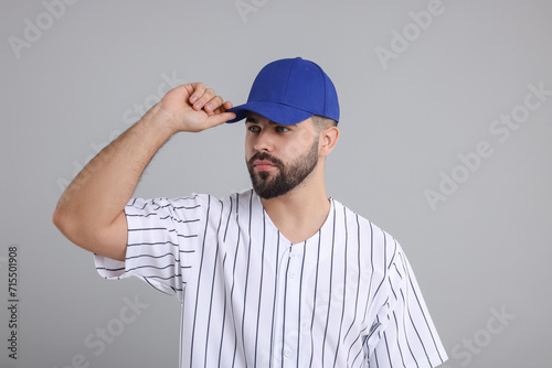 Wallpaper Mural Man in stylish blue baseball cap on light grey background Torontodigital.ca