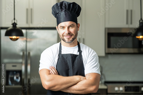 Cooking and culinary concept. Chef cook in uniform on kitchen. Male chef or cook baker man in apron cooking. Portrait of chef cook in beret. Cooking food concept.