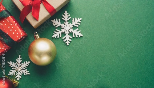 christmas and new year background concept top view of christmas gift box christmas ball and snowflake on green background