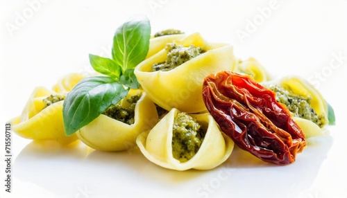 tortellini pasta with pesto and sun dried tomatoes isolated on a white background top and side view italian food bundle photo