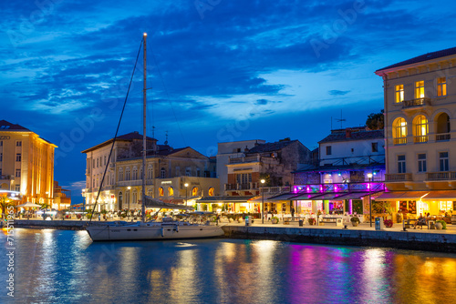 Boat and waterfront restaurants in the evening, Harbor, Porec, Croatia photo