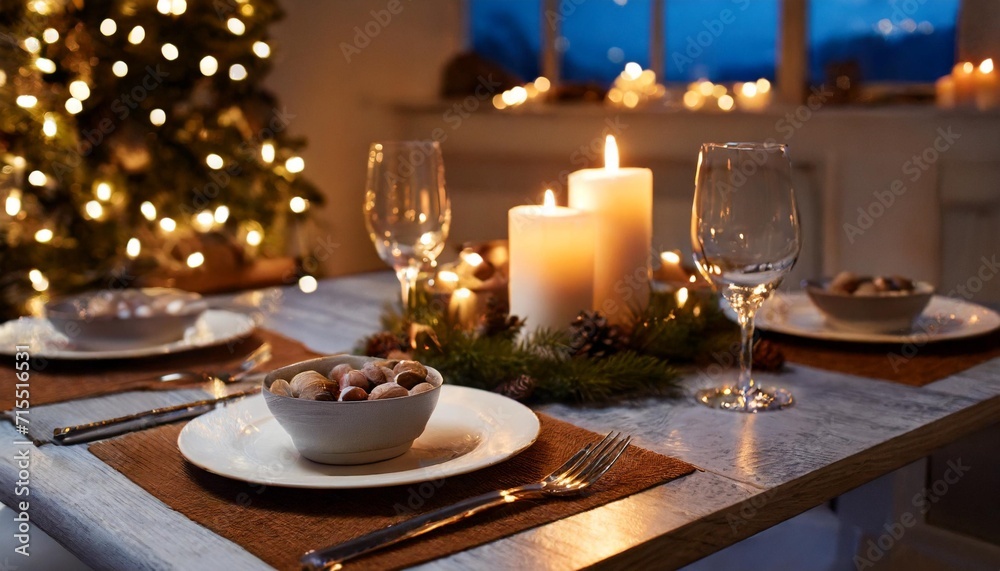 winter holidays dinner party and celebration concept close up of scandinavian christmas table serving with burning candles at home at night