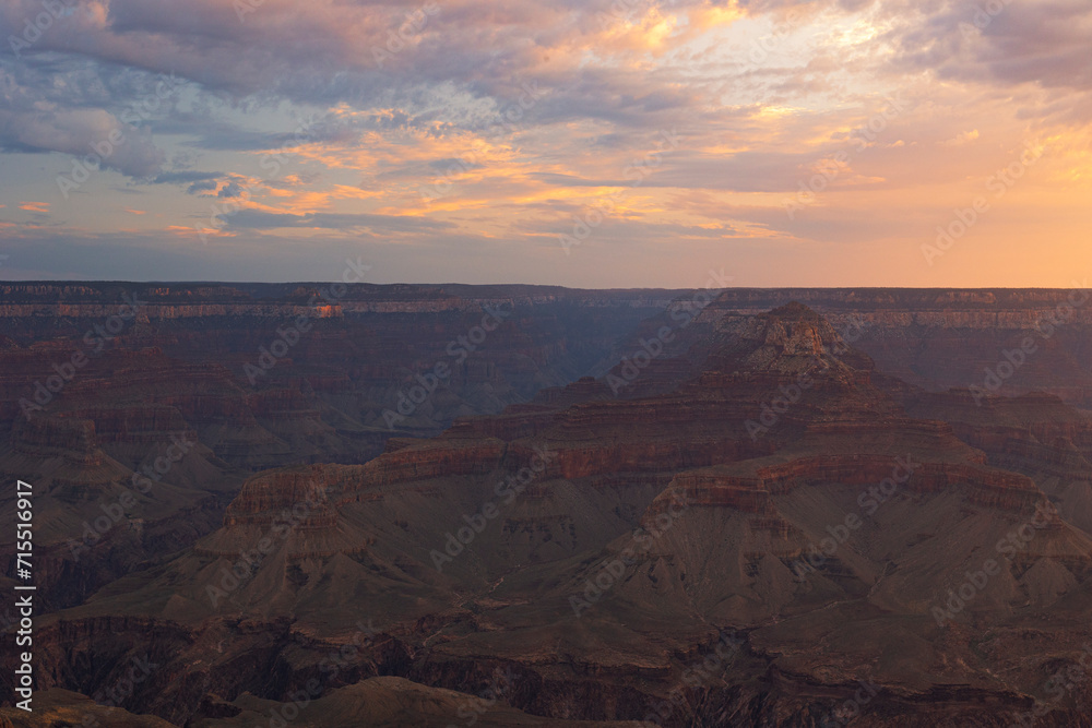 Golden light envelops the Grand Canyon during a summer sunrise, Tusayan, Arizona Golden light envelops the Grand Canyon during a summer sunrise, Tusayan, Arizona