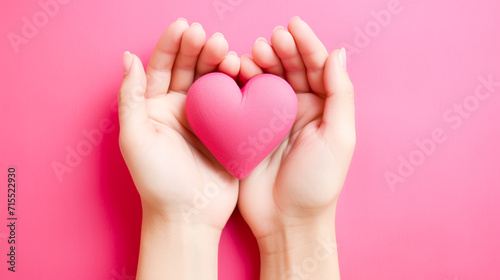 Attractive brunette young Asian woman feels happy and romantic shapes heart gesture expresses tender feelings