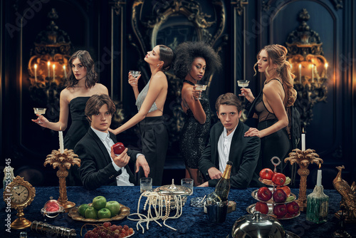 Foto Group of wealth people, young men and women in elegant stylish suits and dresses attending even, celebrating