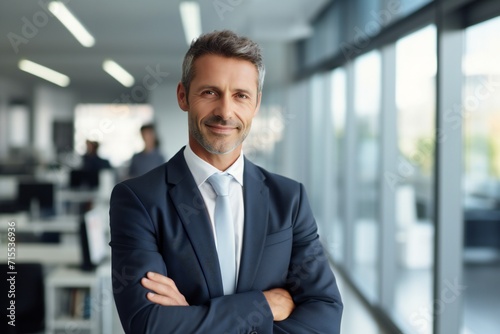 Happy confident american businessman in office looking at camera