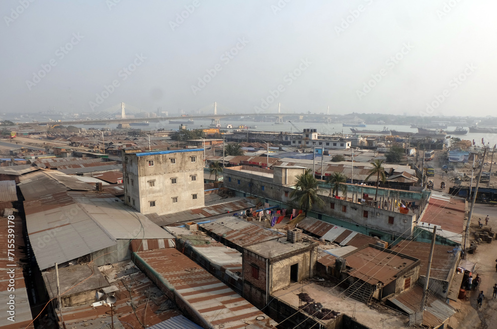 Chittagong's Karnaphuli has become smaller due to encroachment and pollution. People are occupying the place of the river and building houses there.