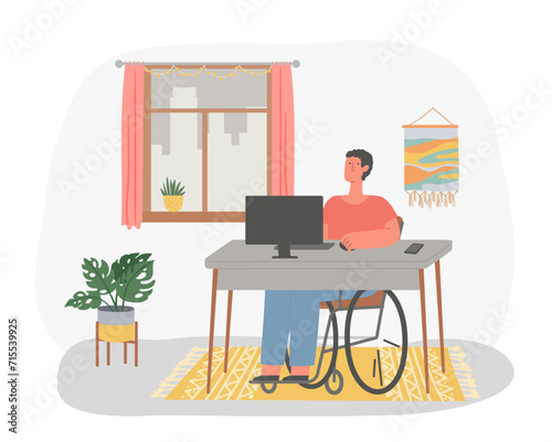 Disabled man in wheelchair working at computer in home. Freelance worker sitting at desk in front of desktop computer