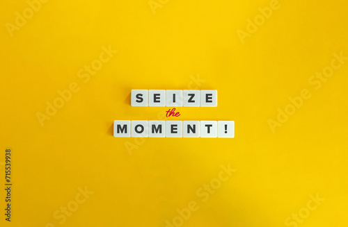 Seize the Moment Exclamation. Block Letter Tiles on Yellow Background. Minimalist Aesthetics. photo
