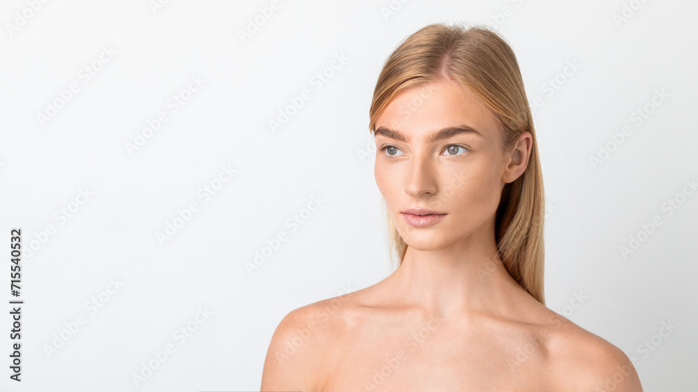 Headshot of pretty blonde woman looking aside thoughtfully, white background Headshot of pretty blonde woman looking aside thoughtfully, white background