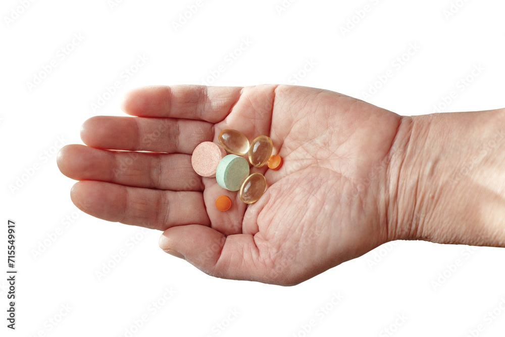 Female hand with various pills isolated on a white background. A handful of medicines. Prescription drugs and nutritional supplements in the palm of your hand. Female hand with various pills isolated on a white background. A handful of medicines. Prescription drugs and nutritional supplements in the palm of your hand.